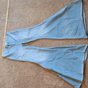Free People jeans. Size 27R. Large bell bottom. Light wash.